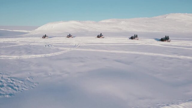 People on snowmobiles on langj&ouml;kull glacier in iceland