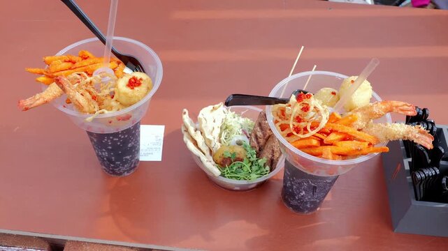 Casual colorful feast, Informal vibrant food presentation, Relaxed meal setup with lively decorative accents, Casual arrangement emphasizing drinks and cheerful