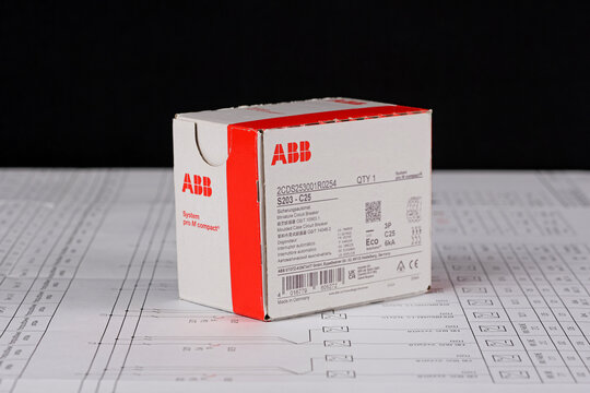 ABB equipment in cardboard packaging on an electronic digram during the assembly of the electrical control panel.