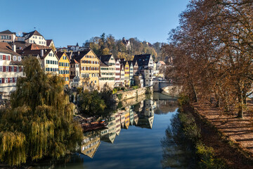 Fototapeta premium Drone shot of the Neckar River and old town of Tübingen in Southern Germany in autumn
