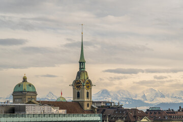 Fototapeta premium Cityscape of Bern, Switzerland and Swiss Alps on Cloudy Day. View from Grosse Schanze 