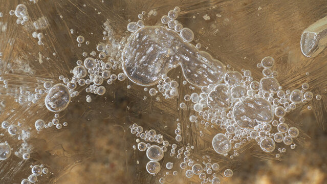 close-up shot of patterns in melting  lake ice