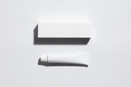 Mockup of a white box and tube of cream or ointment