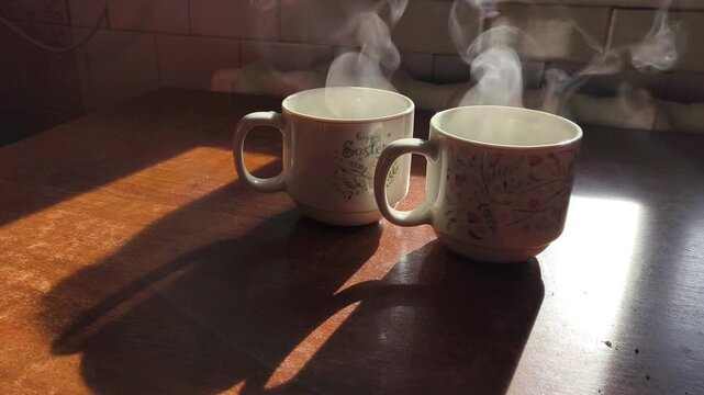 Two Steaming Mugs in Sunlight: Cozy Morning Scene