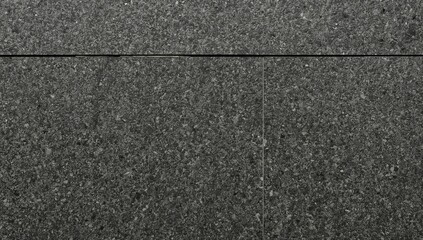 Fototapeta premium Dark Stone Wall With Unique Texture and Patterns in a Modern Building or Setting