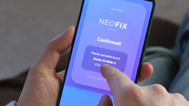Hand holding smartphone with confirmed service request and specialist assigned. Fast online booking, efficient workflow and real time assistance concept. Great for business, innovation, mobile