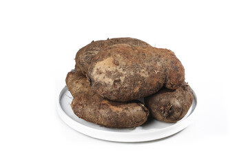 Fresh Yunnan Yam Tubers on White Plate - Traditional Chinese Root Vegetables from Farm