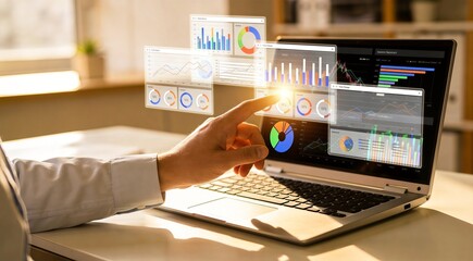 Fototapeta premium Businessman analyzing data on laptop with graphs and charts