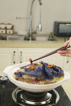 Black Chicken Soup with Cordyceps Mushrooms and Red Dates - Traditional Asian Nourishing Herbal Broth