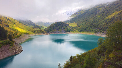 Obraz premium Lake Lac de la Gittaz surrounded by mountains, Auvergne-Rhone-Alpes, France, Europe.