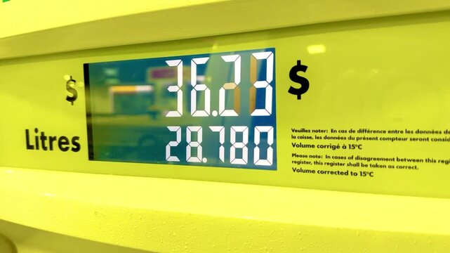 Digital Gas Pump Price Display.Closeup of a fuel pump digital screen showing total cost and liters dispensed, highlighting gasoline price, volume measurement and retail energy expense.