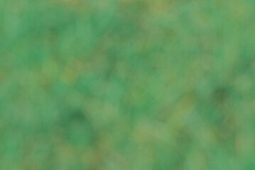 . blurry background in green with light and shadow 