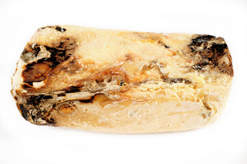 Rotten cheese on white background