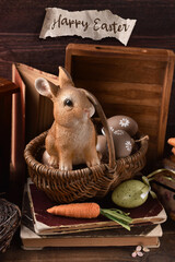 Rustic style Easter card with bunny figurine sitting in wicker basket