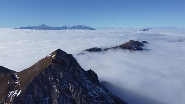 Drone Flight Above Clouds from Mount Stol (Hochstuhl) with View of Triglav, Slovenia