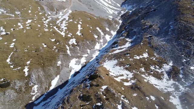 Aerial Drone View of Stol (Hochstuhl) Mountain Ridge with Early Snow in Slovenia