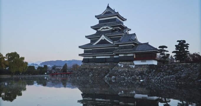 Quiet, still morning at 16th century Matsumoto castle near pond