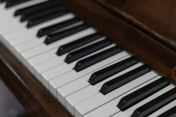 Close-up of Vintage Piano Keys with Selective Focus and Wooden Texture