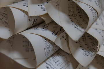 Vintage Sheet Music Scrolls with Musical Notes and Elegant Paper Curves