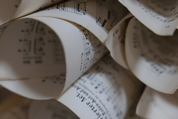 Vintage Sheet Music Scrolls with Musical Notes and Elegant Paper Curves