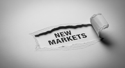 Torn paper reveals "NEW MARKETS" text, suggesting opportunity & discovery
