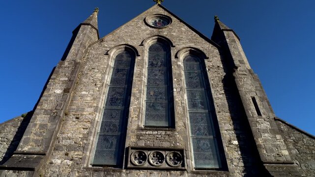 Kilkenny, Ireland,1-24-2025. Low view,Cathedral Cemetery of St. Canice facade. Tilt 4K