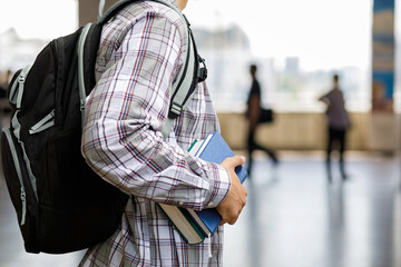 Student with books in hall