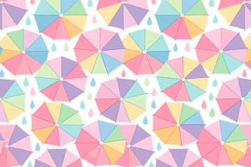 Colorful umbrellas with a pattern of raindrops on a light background in a playful design