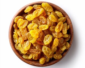 Dried yellow raisins in a wooden bowl on a white background near kitchen utensils and ingredients for baking