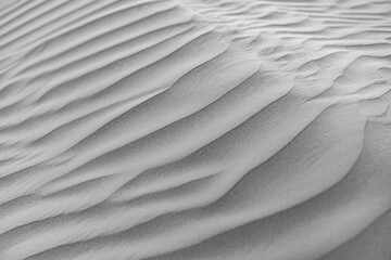 Inspirational black and white sand texture background artistic nature outdoors closeup sandy pattern wall art relax minimal abstract monochrome desert dunes ripples sunlight shadow scenery wallpaper © icemanphotos