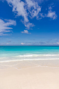Sunny beach blue ocean sunshine fluffy clouds clear sky. Summer nature landscape vacation inspiration shore seaside tropical island coast paradise turquoise water serene scenery bright day wallpaper