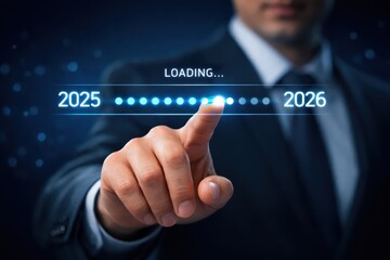 Vision of Progress: A focused individual in business attire navigates the digital realm, his finger poised to usher in the new year. Capturing the essence of progress, anticipation.