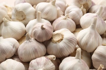 Fresh garlic bulbs as background, closeup view