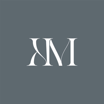 Elegant interlocking KM monogram emblem minimalist abstract logo design suited for luxury branding, fashion, stationery, packaging, corporate identity and creative projects.