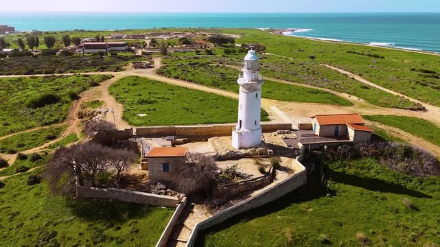 Aerial semi-circle reveal from Paphos Lighthouse to ancient Roman amphitheater and ruins, Cyprus 4K