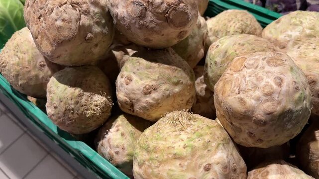 Fresh Celeriac Root Vegetables Stacked in Supermarket Produce Section for Healthy Meals and Cooking