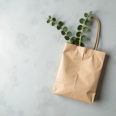 Eco-Friendly Brown Paper Bag with Green Plant on Grey Background