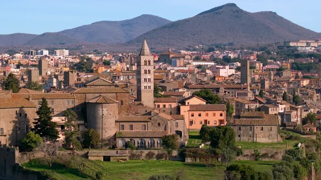 Viterbo Old Town Aerial View and Porta Faul Medieval Gate. Lazio Italy. Cinematic Drone Panning Left to Right over Ancient City Walls 4K 10-bit