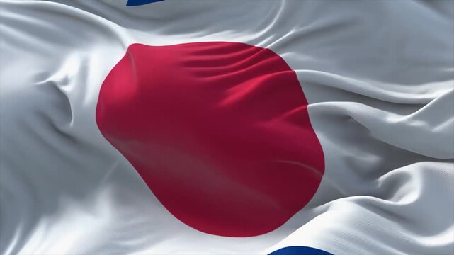 The flag of Japan with a large red disc centered on a white background waving in the wind Japanese flag