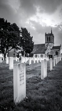Graveyard leads to church, overcast sky. Black and white