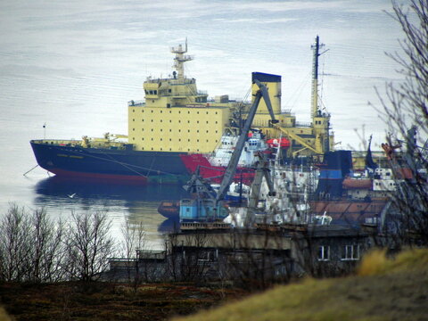 Murmansk, Russia - March 14, 2011: Murmansk seaport, ships, cranes, logistics, maritime romance. Kola Bay. Barents Sea, Gulf Stream.