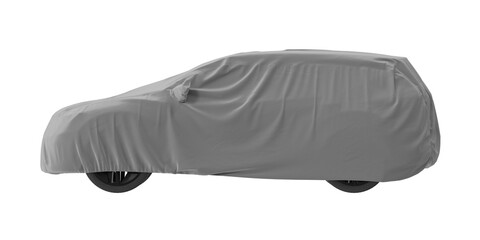 Gray car covered with a protective cloth, isolated on a white background