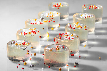 Champagne jelly shooters with Lunar New Year themed sprinkles on top. 