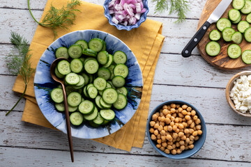 Ingredients for preparing a healthy mini cucumber salad. 