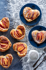 Homemade heart shaped peach filled pastries, ready for eating.