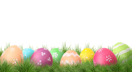 Fototapeta premium Easter eggs in green grass against white background