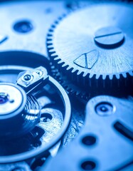 Close-up of clockwork gears in cool blue light, showing intricate details
