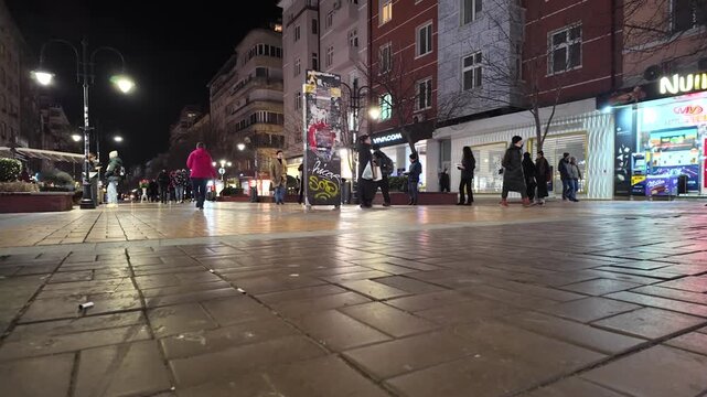 Sofia, Bulgaria. people walking on the street at night