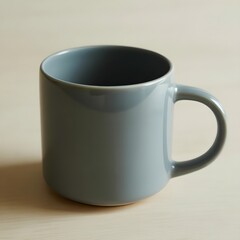 A light blue ceramic mug with a handle resting on a wooden surface.