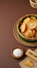 Authentic Fijian Golden Taro Chips in Woven Pandanus Bowl with Sea Salt and Earth-Toned Left Copy Space